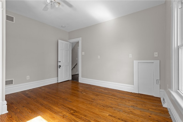 empty room with wood-type flooring and ceiling fan