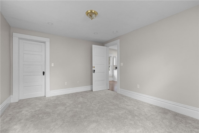 empty room with light colored carpet