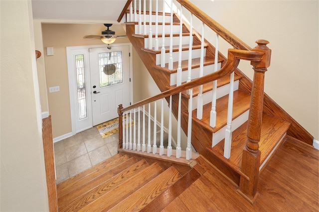 tiled entrance foyer featuring ceiling fan