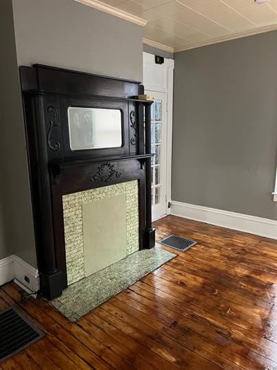 details with hardwood / wood-style flooring and crown molding