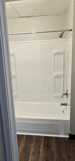 bathroom featuring hardwood / wood-style flooring and shower / bath combination