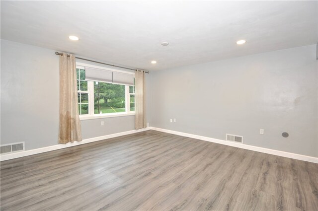 unfurnished room with light hardwood / wood-style floors