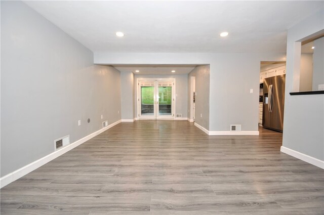 spare room featuring light wood-type flooring