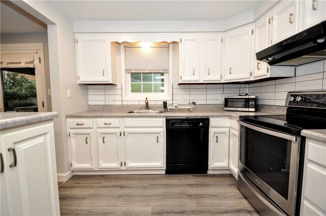 kitchen featuring appliances with stainless steel finishes, sink, and white cabinetry