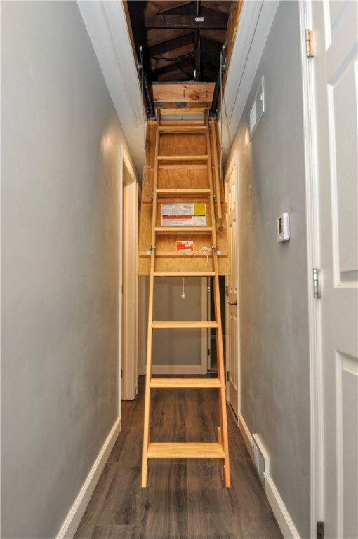 stairs with wood-type flooring