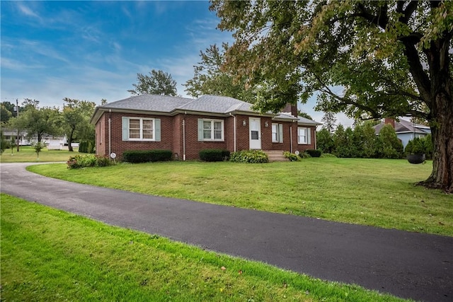 1820 N Hermitage Rd, Hermitage, PA 16148 - bungalow with a chimney, brick siding, and a front yard