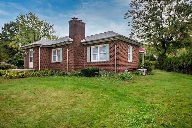 1820 N Hermitage Rd, Hermitage, PA 16148 - view of side of home with a chimney, brick siding, and a lawn