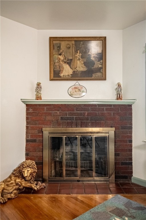 room details featuring hardwood / wood-style floors and a fireplace