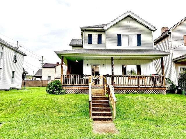 view of front of property featuring a front yard and a porch