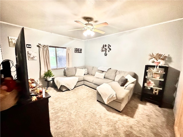 carpeted living room with ceiling fan and crown molding