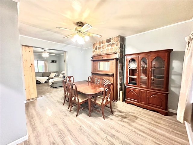 dining space with ceiling fan, light hardwood / wood-style flooring, and crown molding