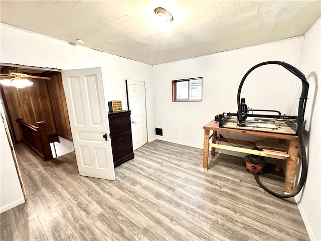 office with ceiling fan and hardwood / wood-style flooring