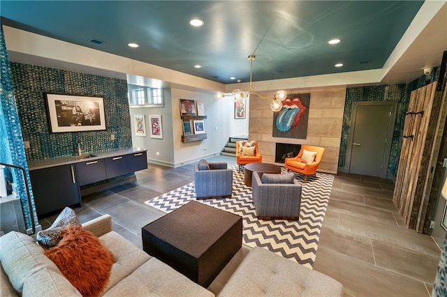 living room with a tiled fireplace