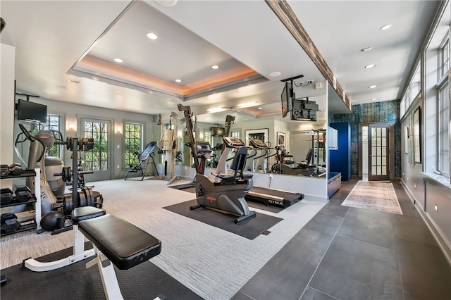 gym with a raised ceiling