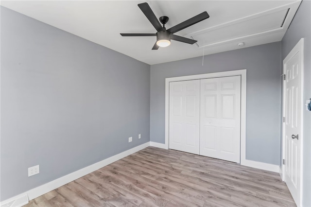 unfurnished bedroom with a closet, ceiling fan, and light hardwood / wood-style flooring