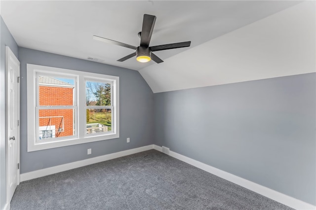 additional living space with ceiling fan, vaulted ceiling, and carpet