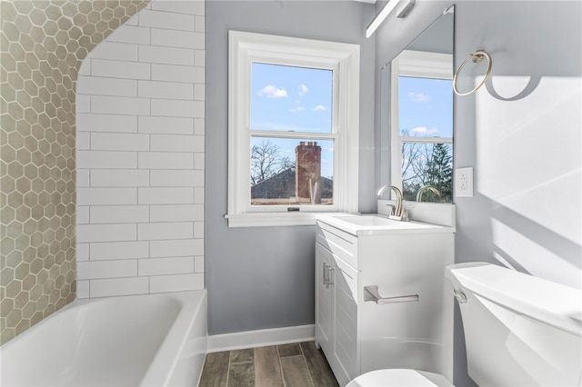 full bathroom featuring wood-type flooring, vanity, toilet, and shower / tub combo with curtain