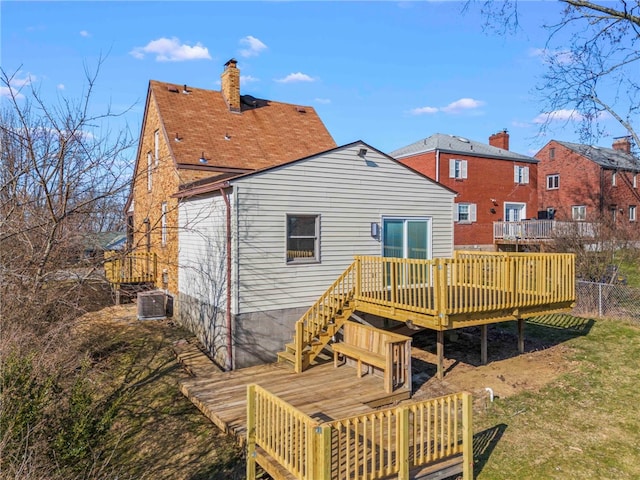 rear view of property featuring a deck