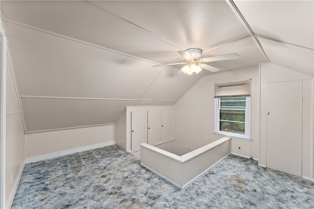 bonus room with ceiling fan, light colored carpet, and vaulted ceiling