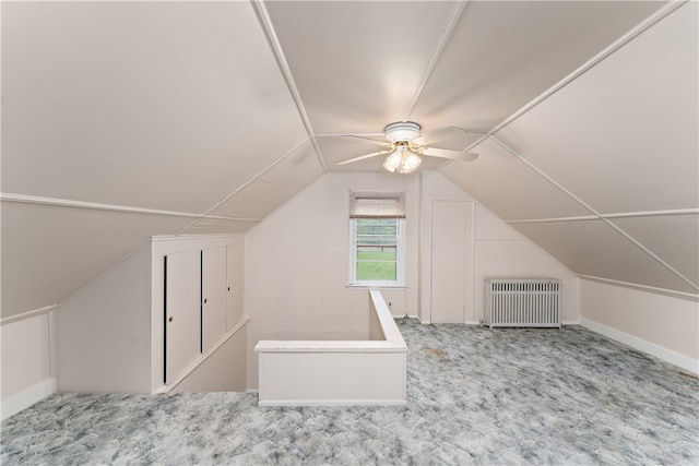 bonus room with heating unit, lofted ceiling, ceiling fan, and carpet flooring