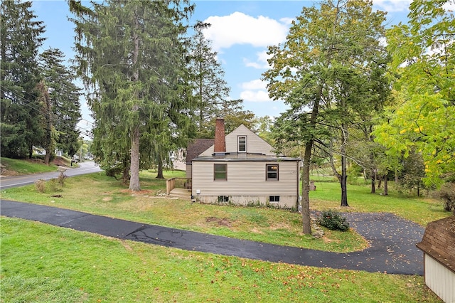 view of home's exterior featuring a yard