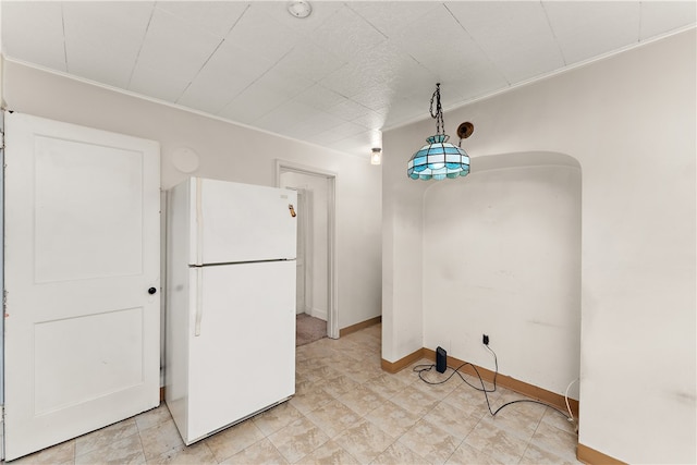 kitchen featuring pendant lighting and white refrigerator