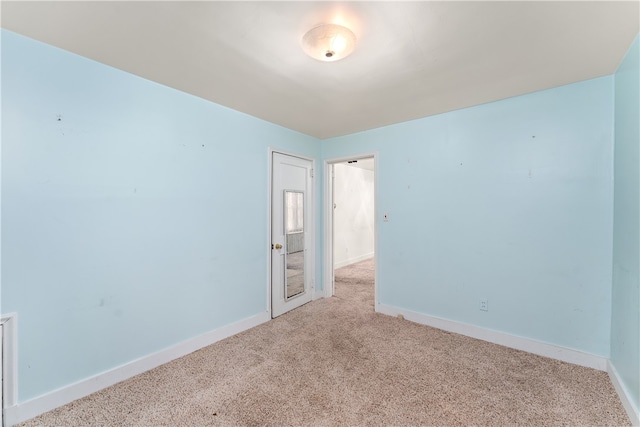 empty room featuring light colored carpet