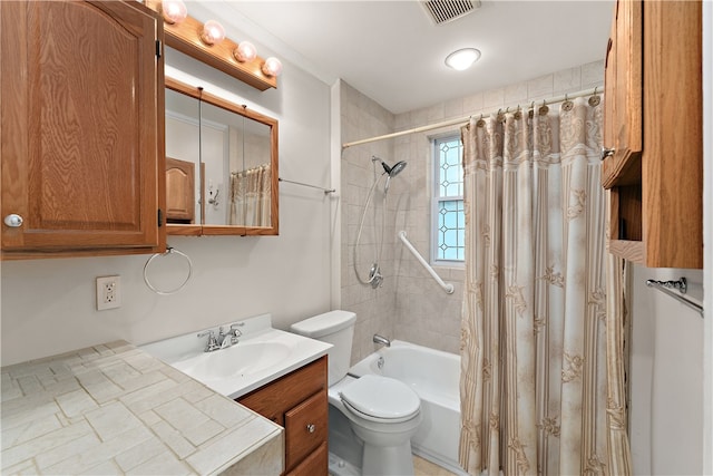 full bathroom featuring vanity, toilet, and shower / bath combination with curtain