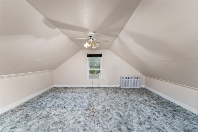 bonus room featuring ceiling fan, radiator heating unit, lofted ceiling, and carpet