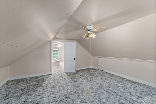 bonus room featuring carpet floors, vaulted ceiling, and ceiling fan