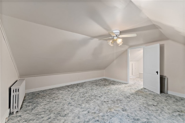 bonus room featuring carpet, lofted ceiling, ceiling fan, and radiator heating unit