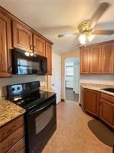 kitchen featuring black appliances and ceiling fan