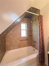 bathroom featuring vanity and shower / tub combo