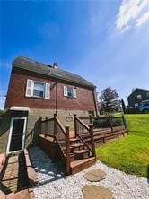 back of house with a wooden deck