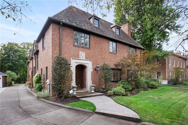 view of front facade with a front lawn and a garage