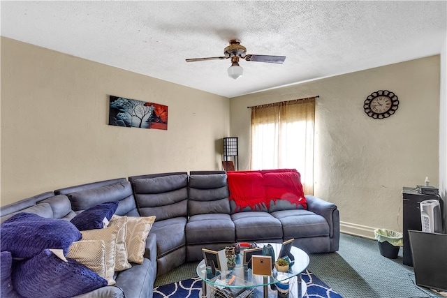 carpeted living room featuring a textured ceiling and ceiling fan