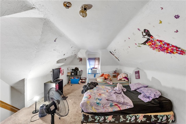 bedroom featuring lofted ceiling, a textured ceiling, and carpet flooring