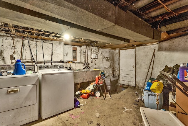 basement with independent washer and dryer and sink