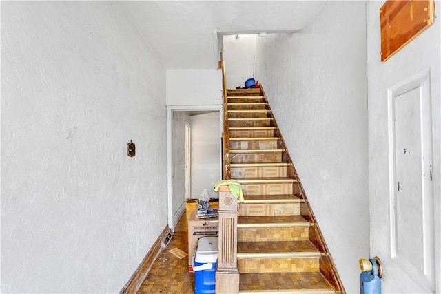 stairway with parquet floors