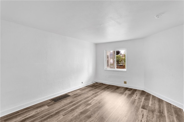 empty room featuring hardwood / wood-style flooring