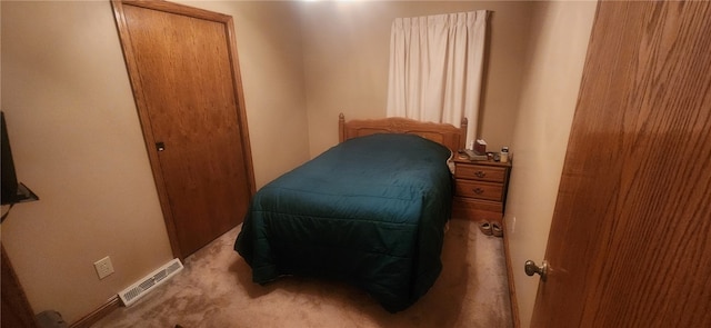 bedroom with light colored carpet