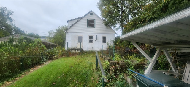 rear view of house with a lawn