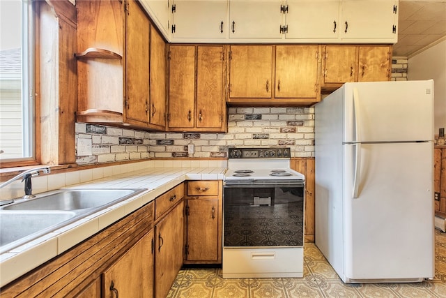 kitchen with white appliances, tasteful backsplash, and sink