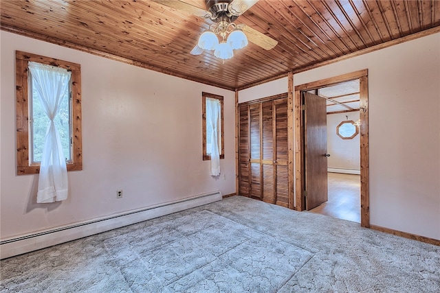 unfurnished bedroom featuring ceiling fan, light colored carpet, baseboard heating, and wood ceiling