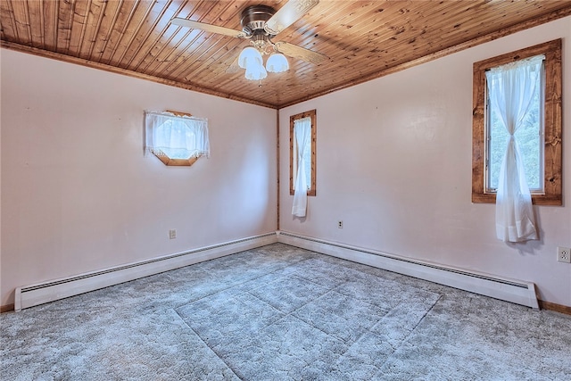 carpeted spare room with wood ceiling, ornamental molding, baseboard heating, and ceiling fan