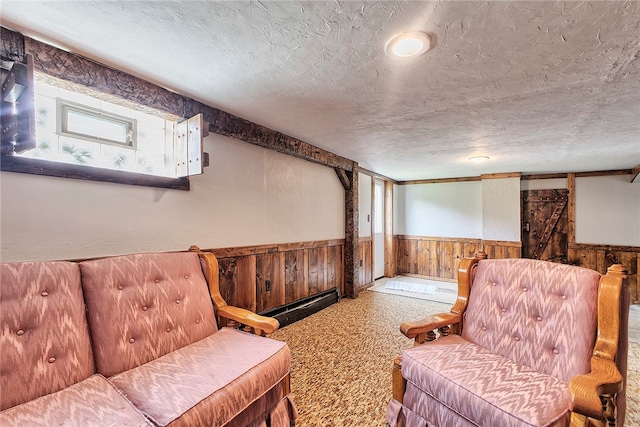 interior space featuring a textured ceiling and wooden walls