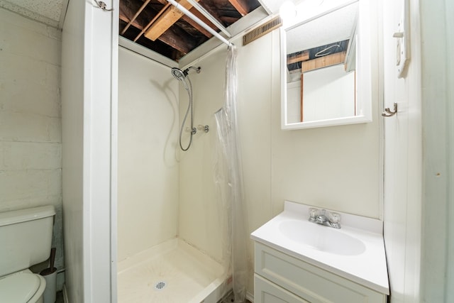 bathroom featuring vanity, toilet, and a shower with shower curtain