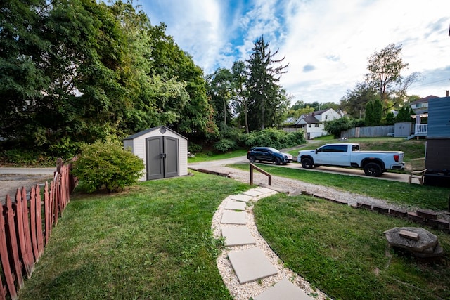 view of yard with a storage unit