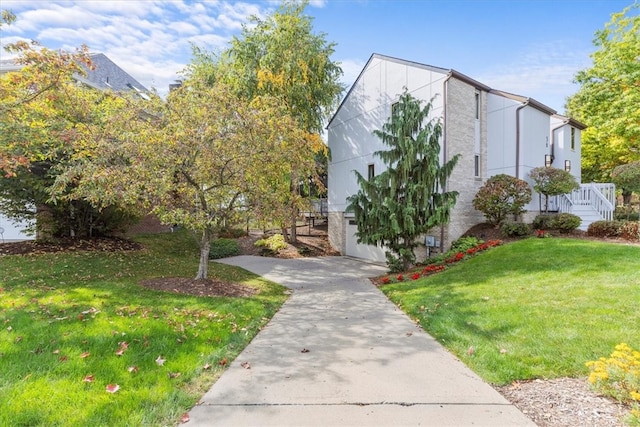 view of front of home with a front lawn