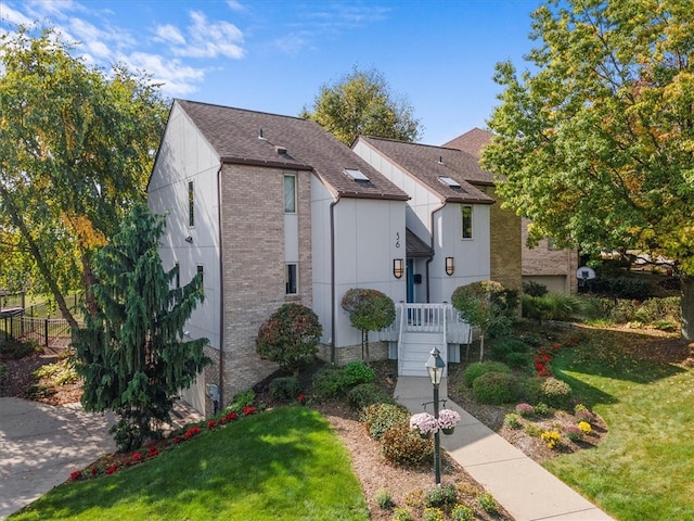 view of front of home with a front lawn